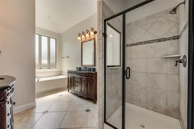 an empty room with windows and ceiling fan