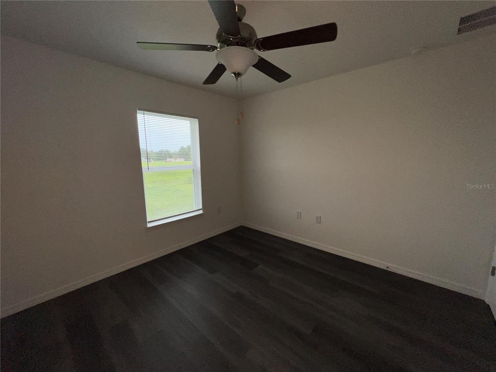 9 Maple Lane Ocklawaha, FL 32179 - Photo 17 of 26 an empty room with a window