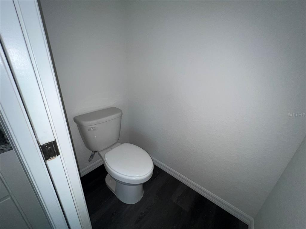 9 Maple Lane Ocklawaha, FL 32179 - Photo 25 of 26 a white toilet sitting next to a sink