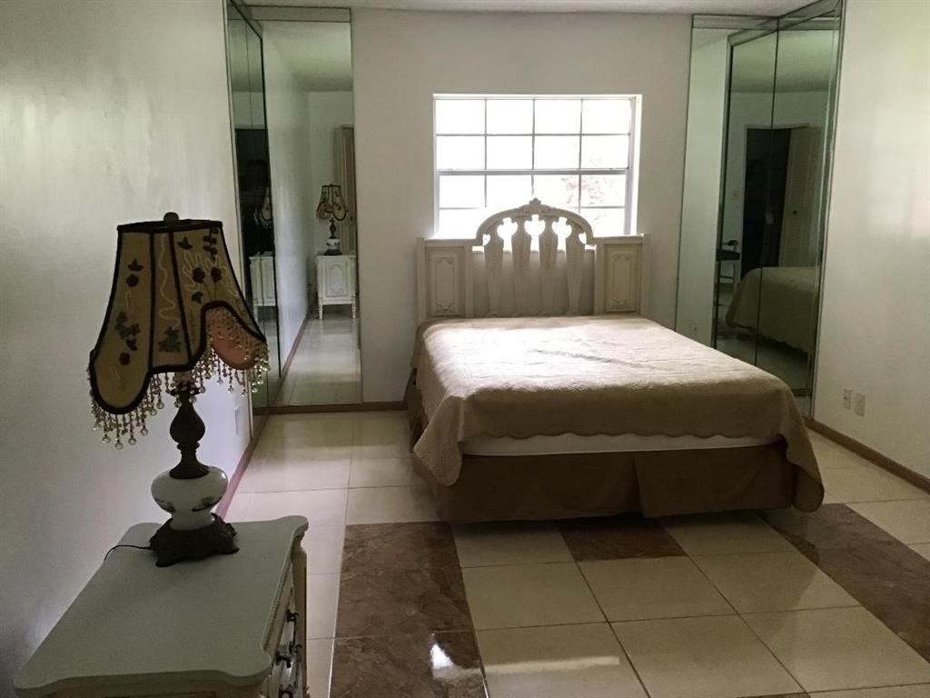 5641 Southwest 2nd Court, Unit 212 Margate, FL 33068 - Photo 4 of 18 a bedroom with a bed and a window