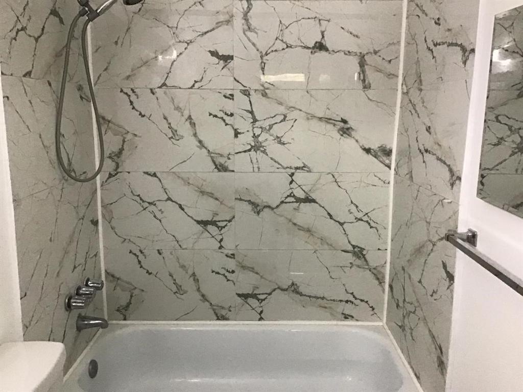 5641 Southwest 2nd Court, Unit 212 Margate, FL 33068 - Photo 7 of 18 a bathroom with a bathtub