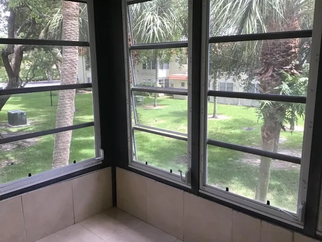 a view of an empty room with a window