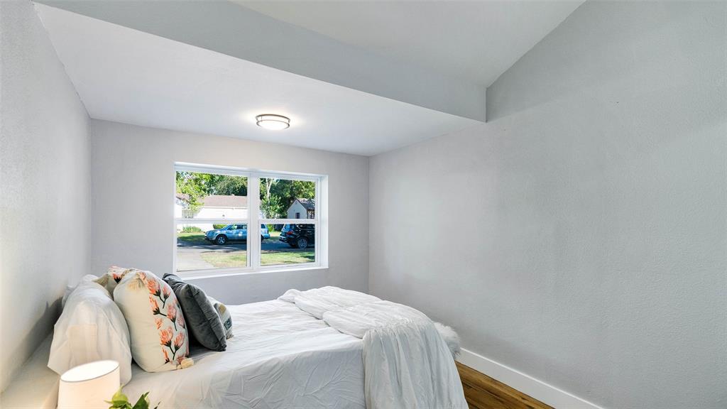 10523 Newcombe Drive Dallas, TX 75228 - Photo 15 of 25 a bedroom with a bed and a window