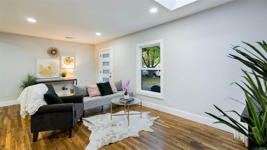 10523 Newcombe Drive Dallas, TX 75228 - Photo 19 of 25 a living room with furniture and a potted plant