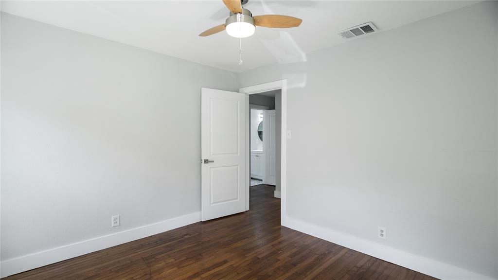 10523 Newcombe Drive Dallas, TX 75228 - Photo 20 of 25 a view of an empty room with wooden floor