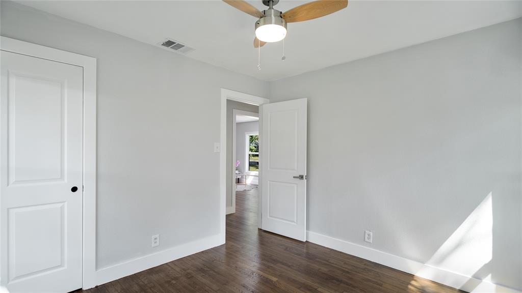 10523 Newcombe Drive Dallas, TX 75228 - Photo 21 of 25 wooden floor in an empty room with a window