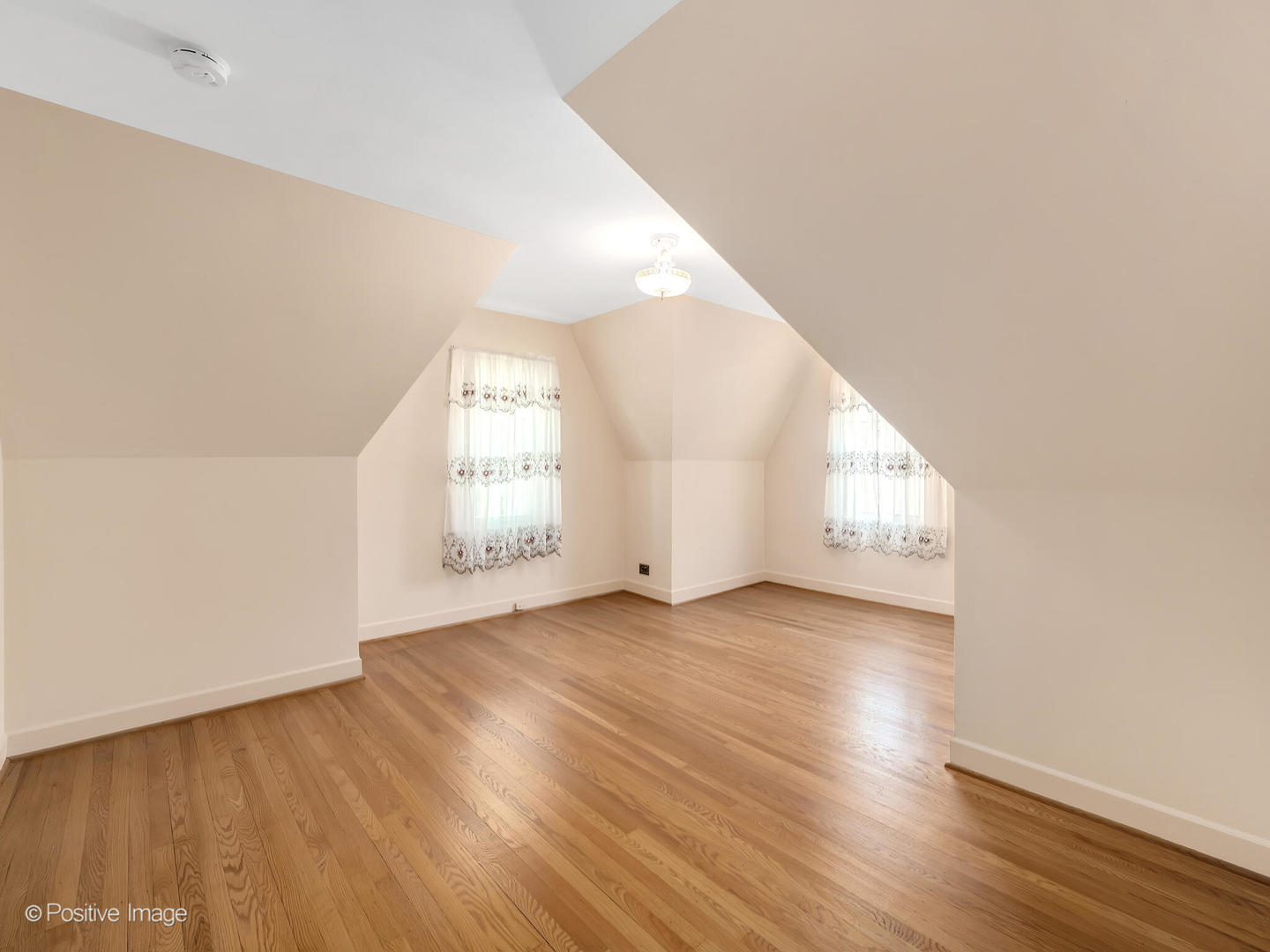 2216 14th Avenue North Riverside, IL 60546 - Photo 13 of 24 an empty room with wooden floor and windows