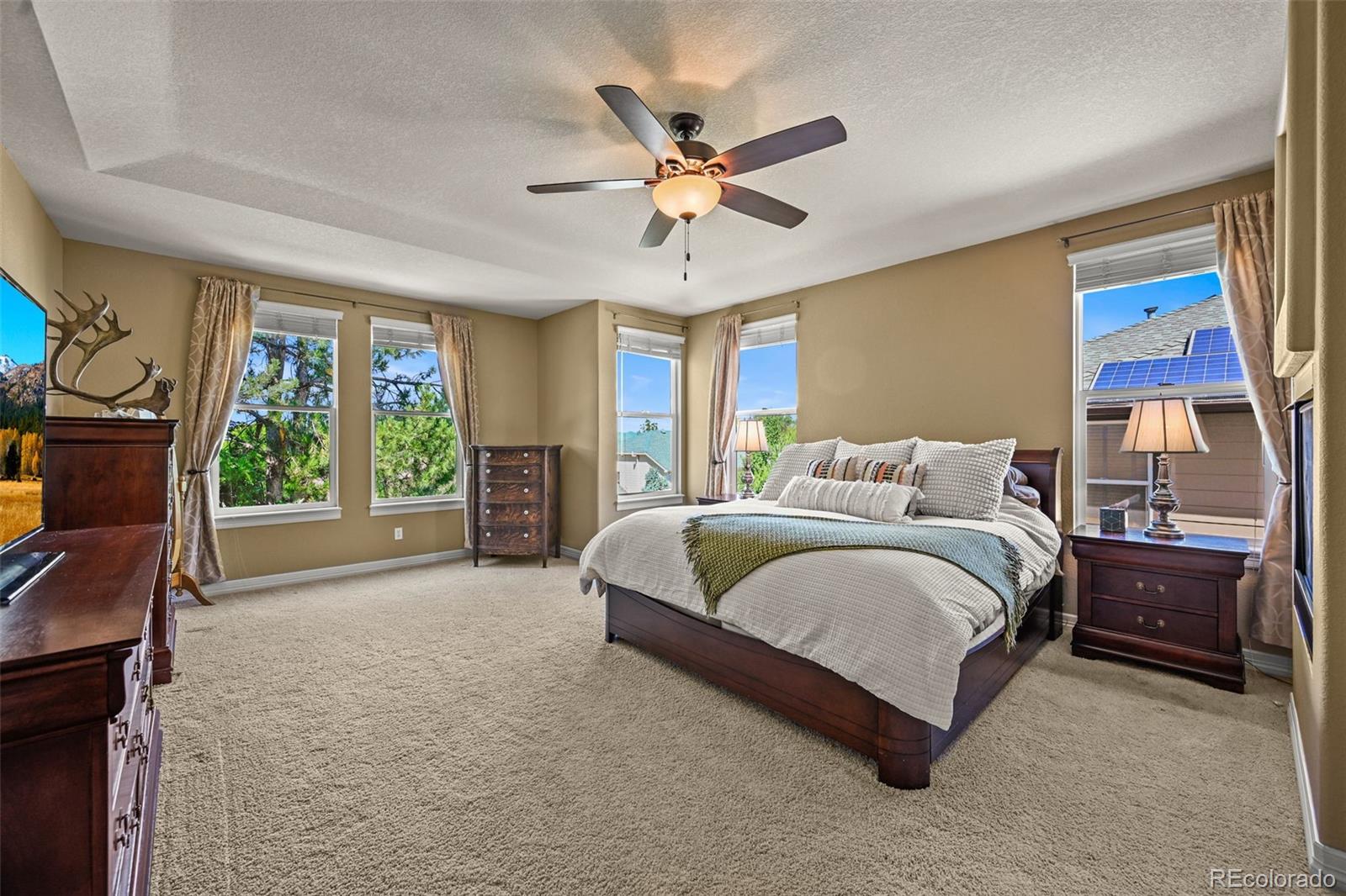 a spacious bedroom with a bed and window