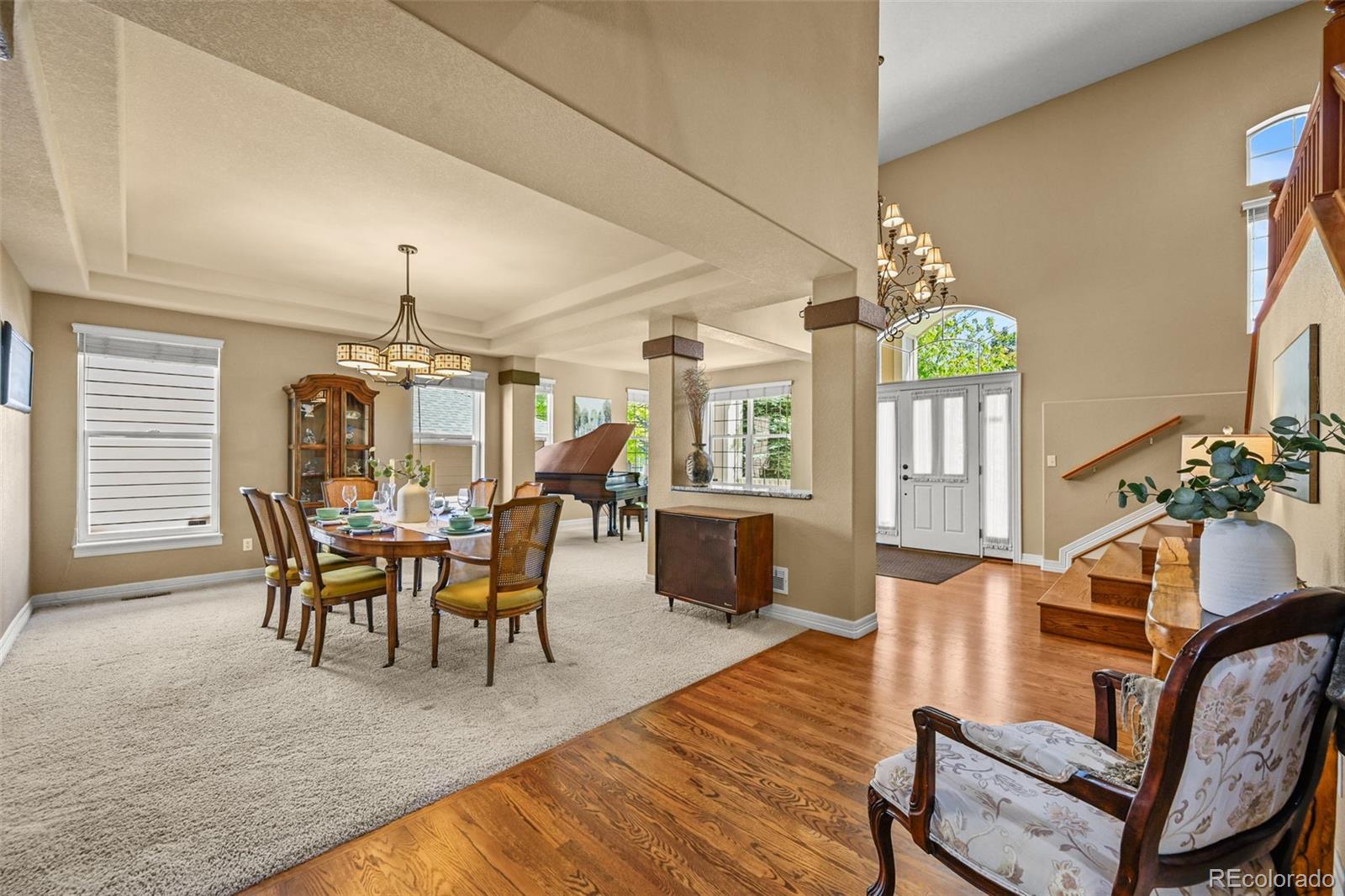 10123 Mockingbird Lane Highlands Ranch, CO 80129 - Photo 14 of 43 a view of a dining room with furniture and wooden floor
