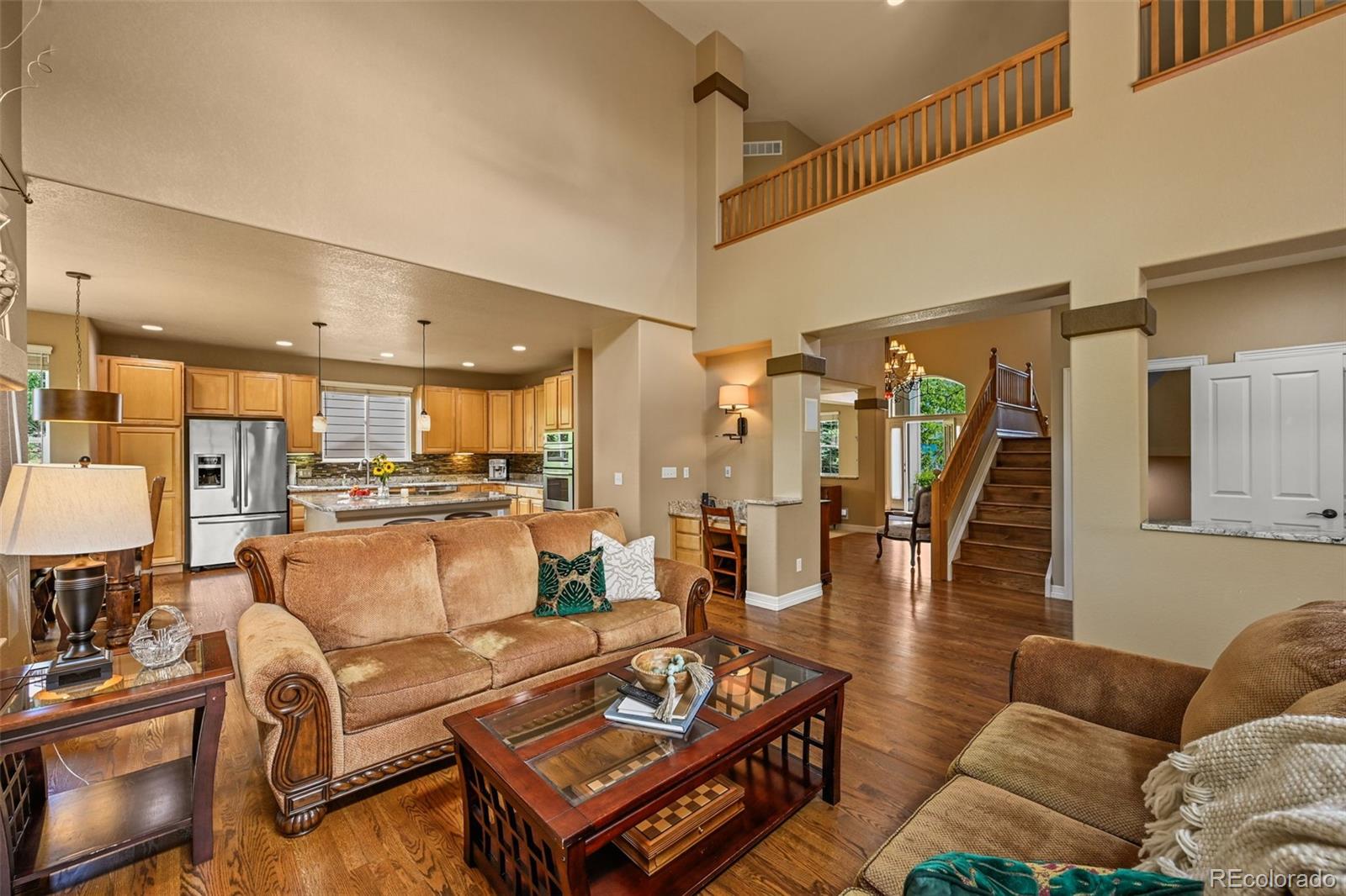 10123 Mockingbird Lane Highlands Ranch, CO 80129 - Photo 16 of 43 a living room with furniture and a view of kitchen