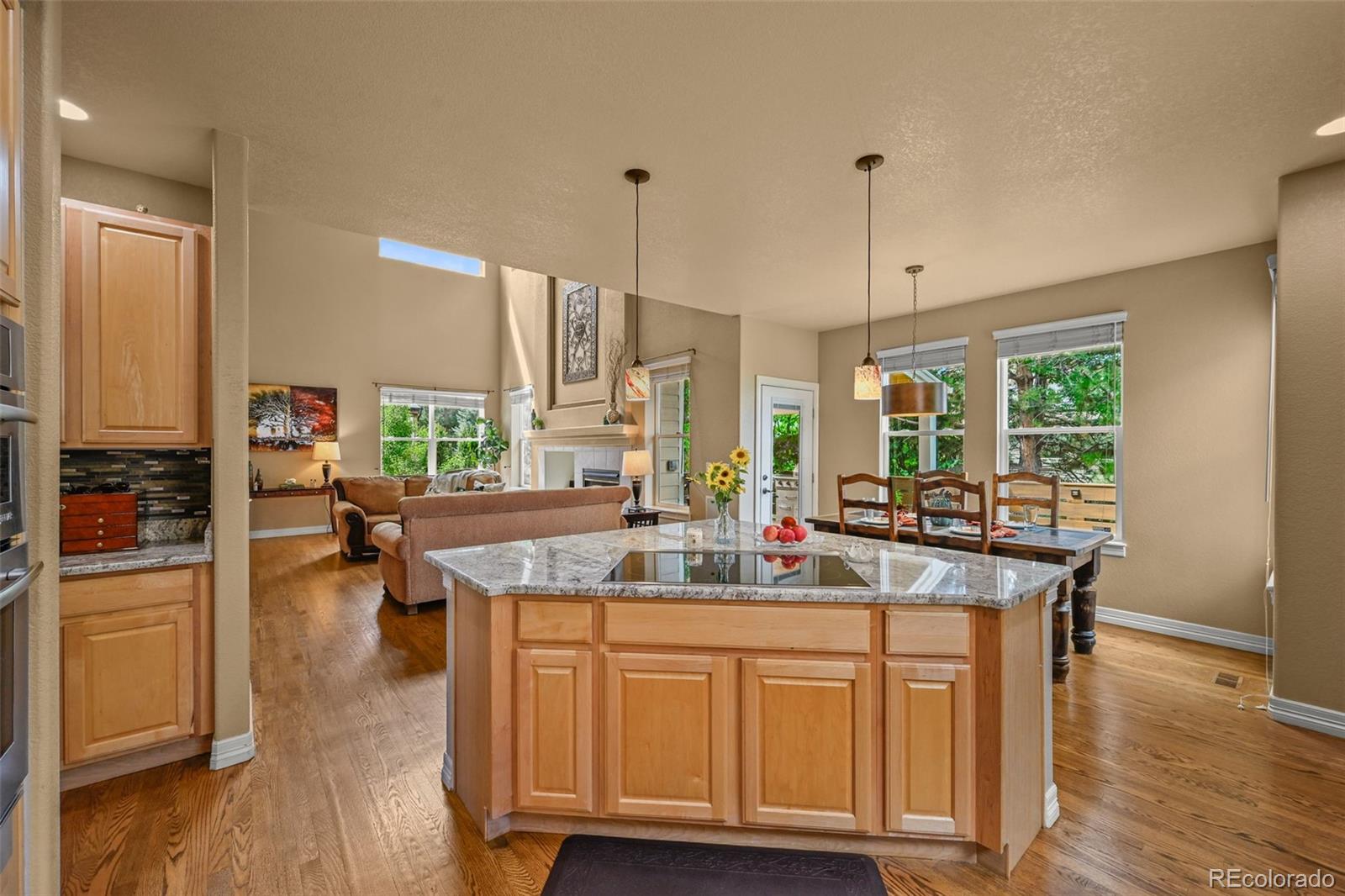 10123 Mockingbird Lane Highlands Ranch, CO 80129 - Photo 18 of 43 a kitchen with sink cabinets and wooden floor