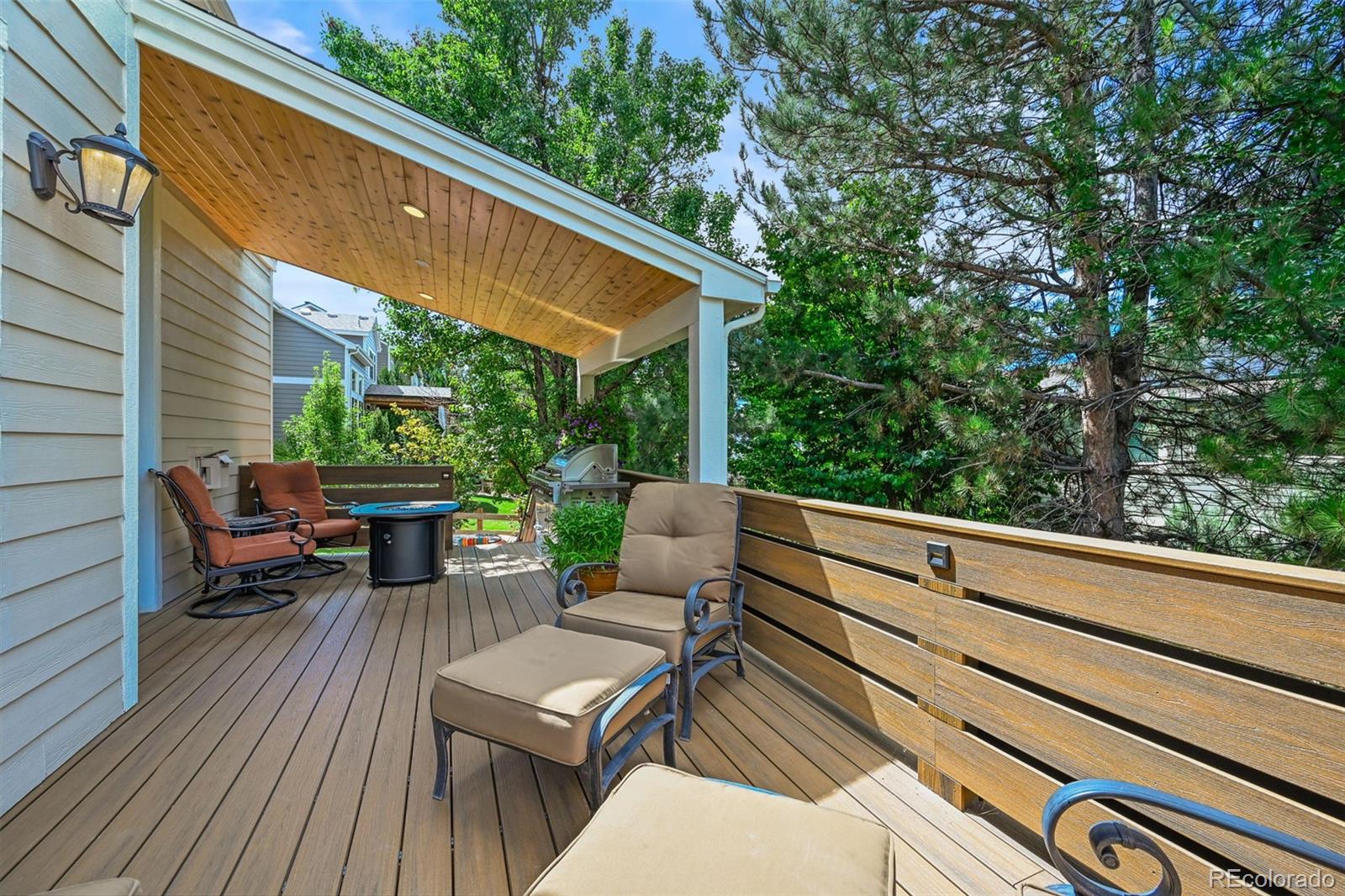 10123 Mockingbird Lane Highlands Ranch, CO 80129 - Photo 22 of 45 a view of backyard with a table and chairs