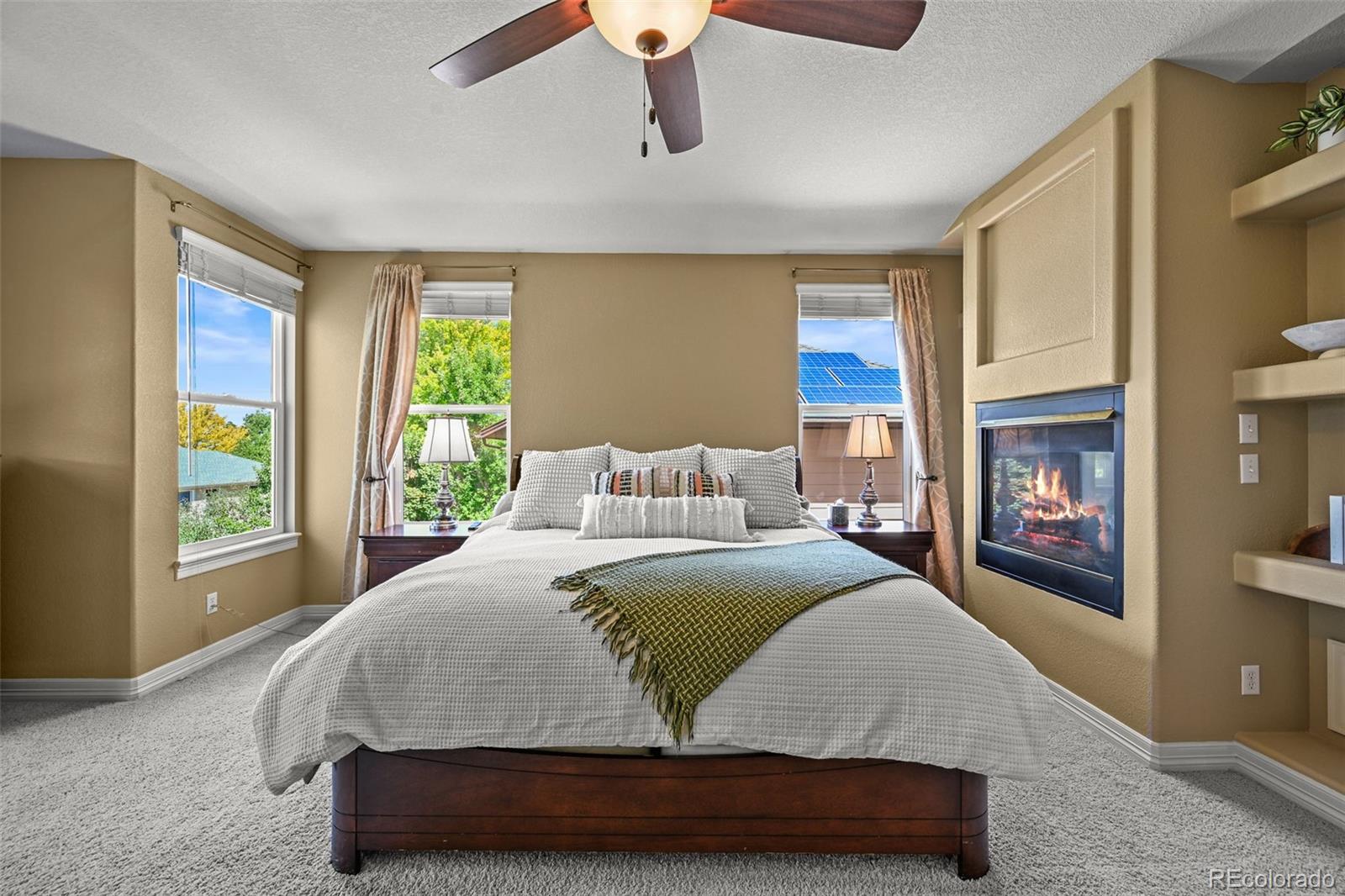 10123 Mockingbird Lane Highlands Ranch, CO 80129 - Photo 26 of 43 a spacious bedroom with a large bed and a window