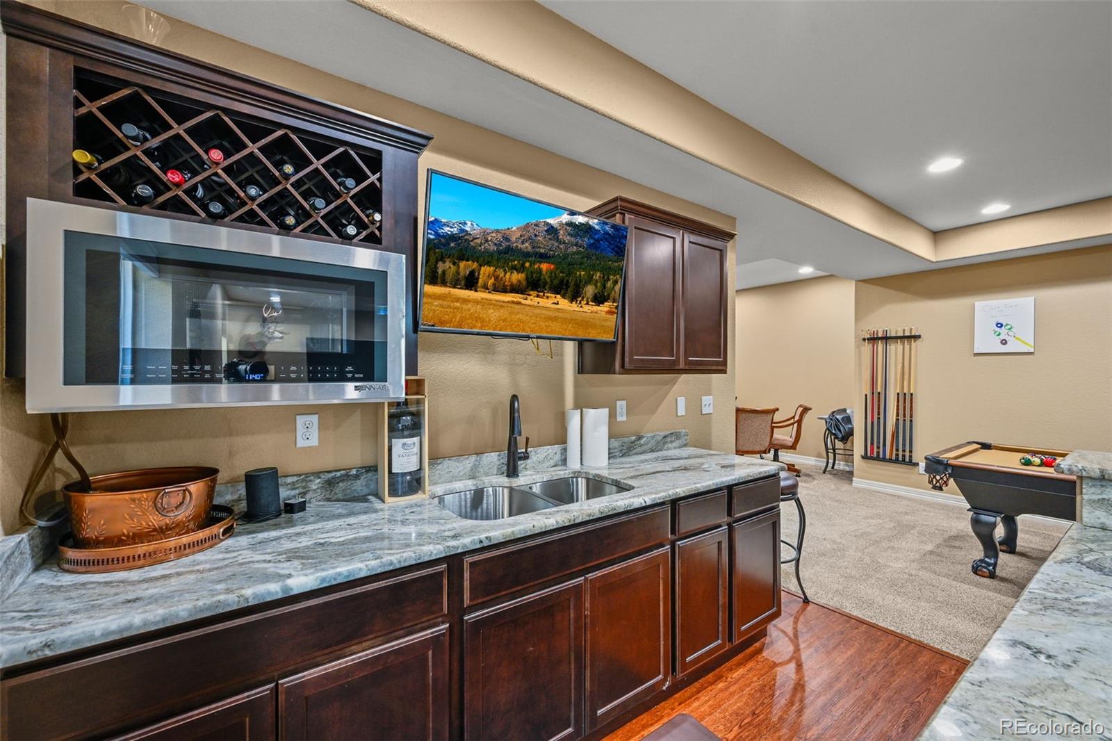 10123 Mockingbird Lane Highlands Ranch, CO 80129 - Photo 4 of 45 a kitchen with a sink and cabinets