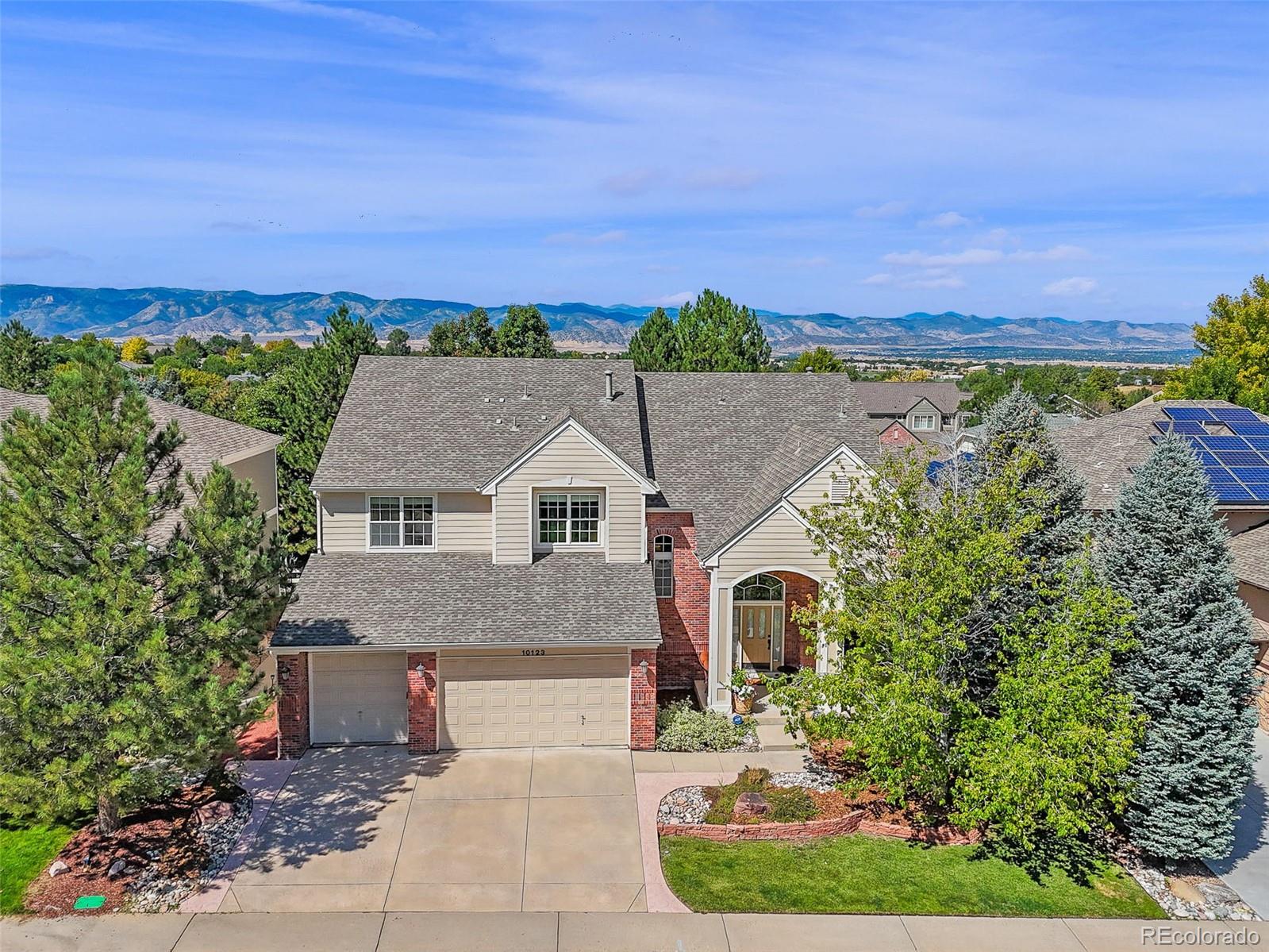 10123 Mockingbird Lane Highlands Ranch, CO 80129 - Photo 9 of 45 an aerial view of a house with a yard