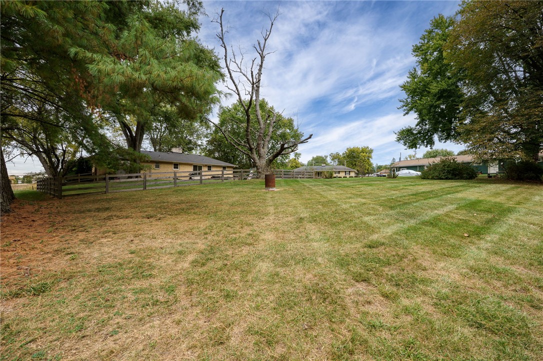 6950 Red Lion 5 Points Road Springboro, OH 45066 - Photo 64 of 78 Expansive outdoor space features a well-maintained lawn and mature trees, perfect for leisure.