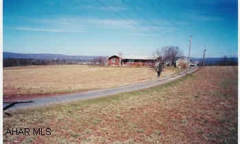 1223 Pointer Road Breezewood, PA 15533 - Photo 1 of 1 a view of a yard with an outdoor space