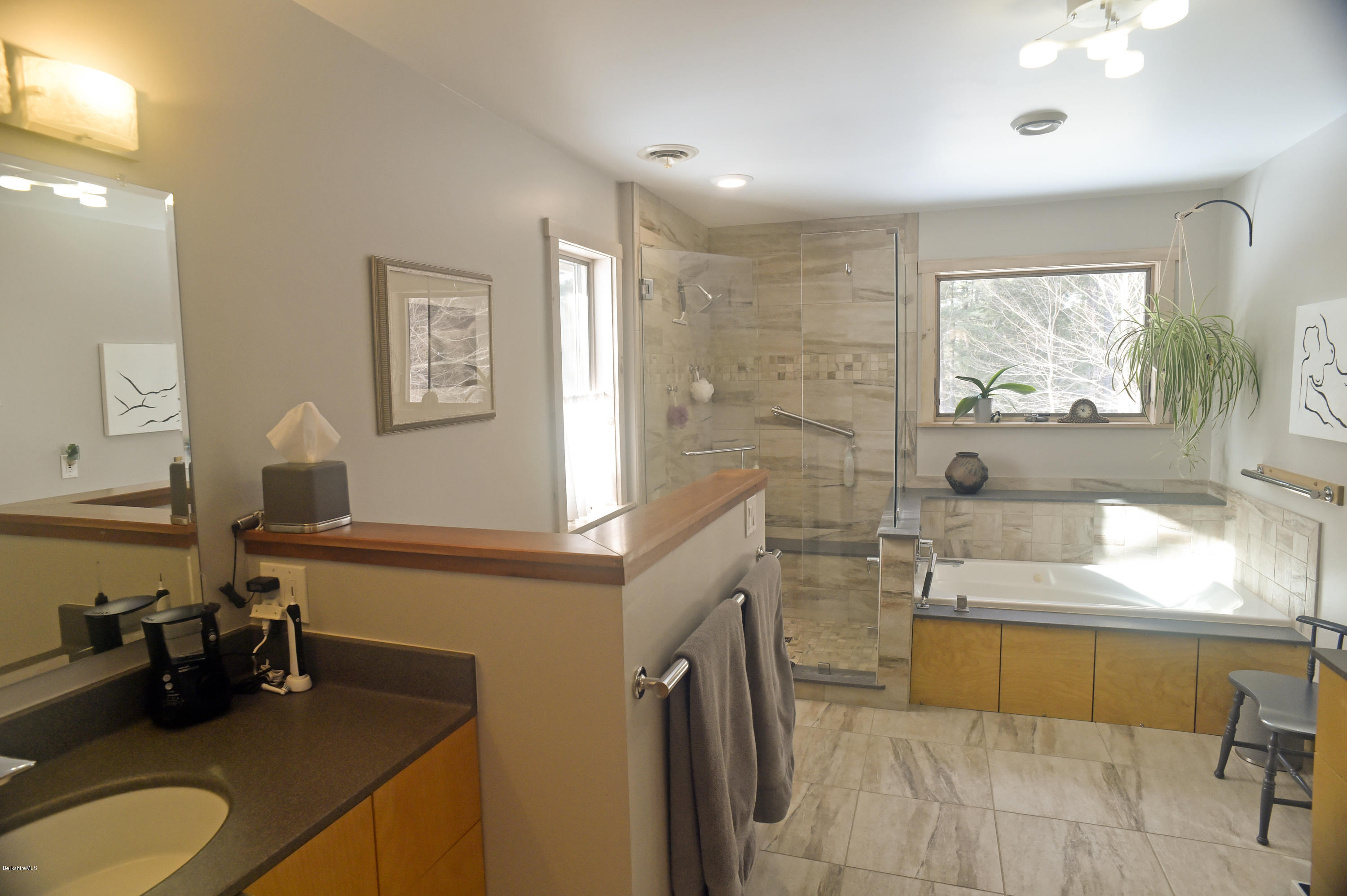 98 Ridge Road Worthington, MA 01098 - Photo 8 of 16 a bathroom with a granite countertop sink and a large mirror