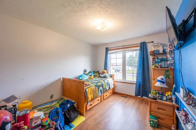 a bed room with furniture and a window