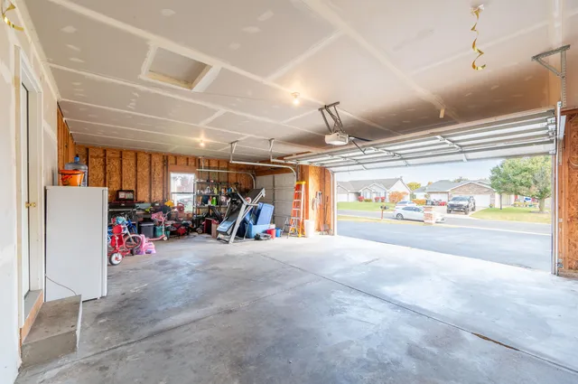 a view of a room with wooden floor and furniture