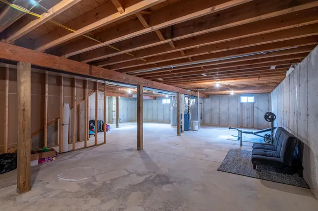 a view of a hallway with wooden shelves