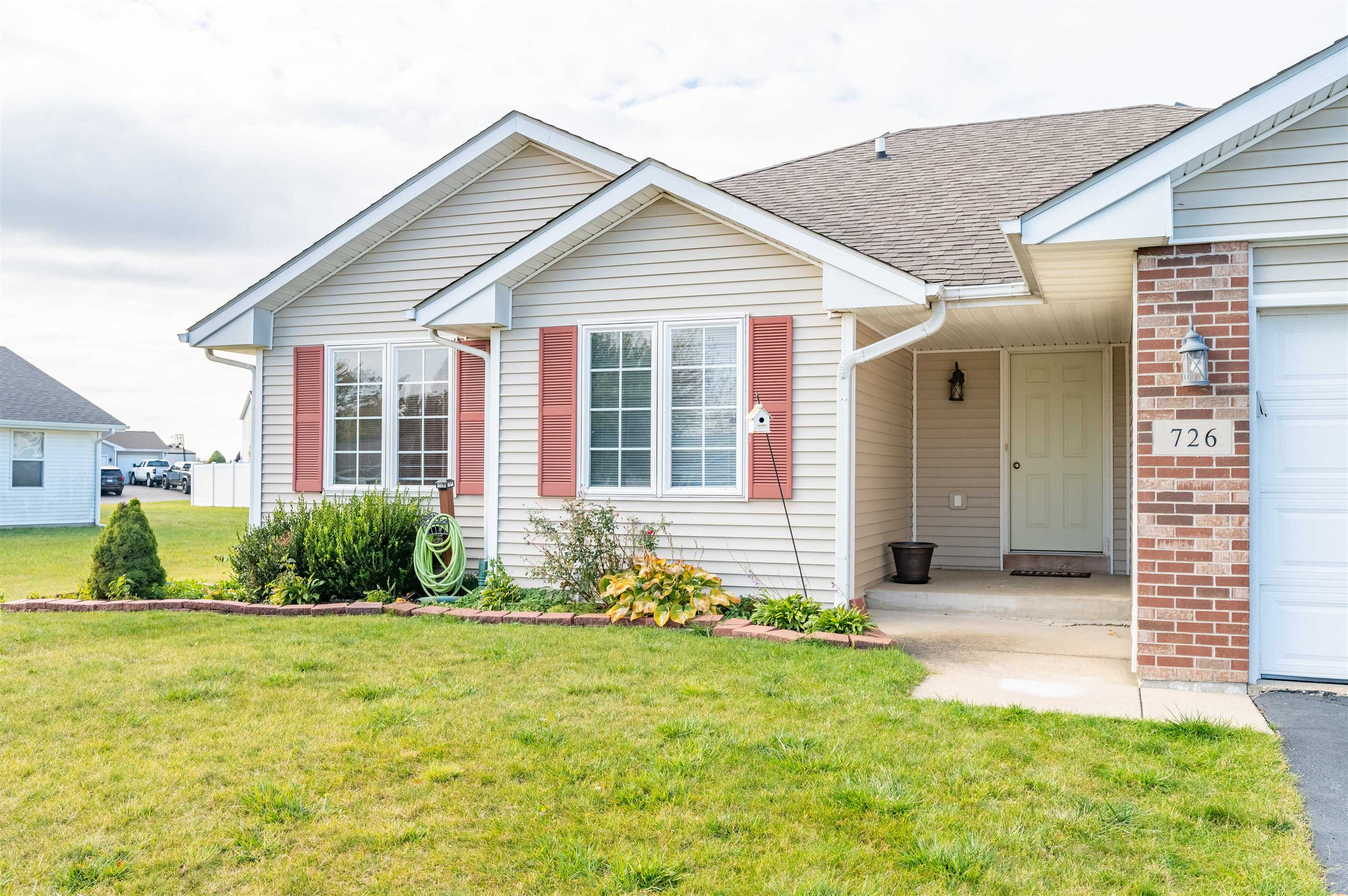 726 Golden Prairie Drive Davis Junction, IL 61020 - Photo 3 of 29 a front view of a house with a yard
