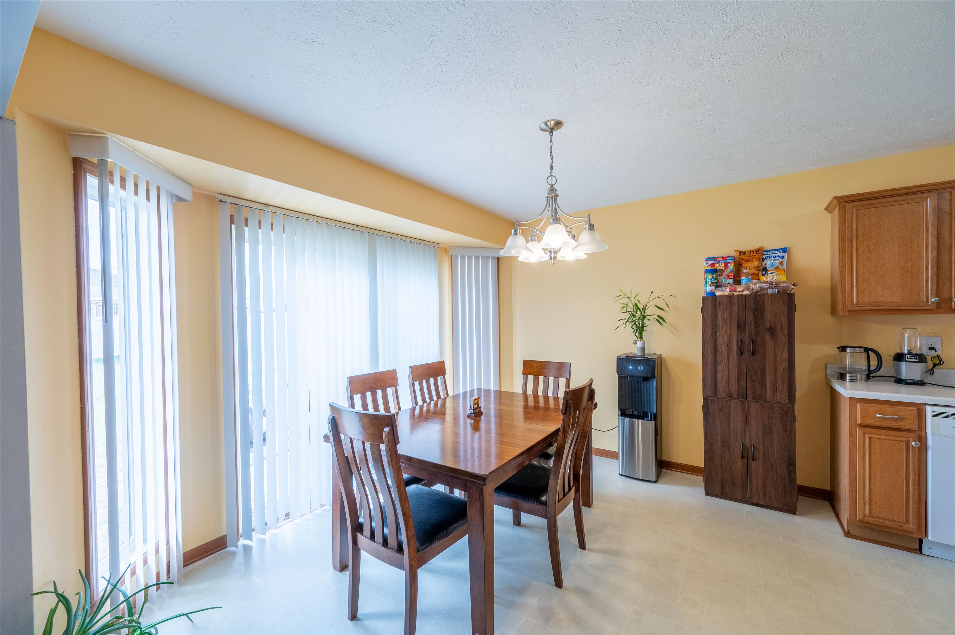 726 Golden Prairie Drive Davis Junction, IL 61020 - Photo 8 of 29 a view of a dining room with furniture and chandelier