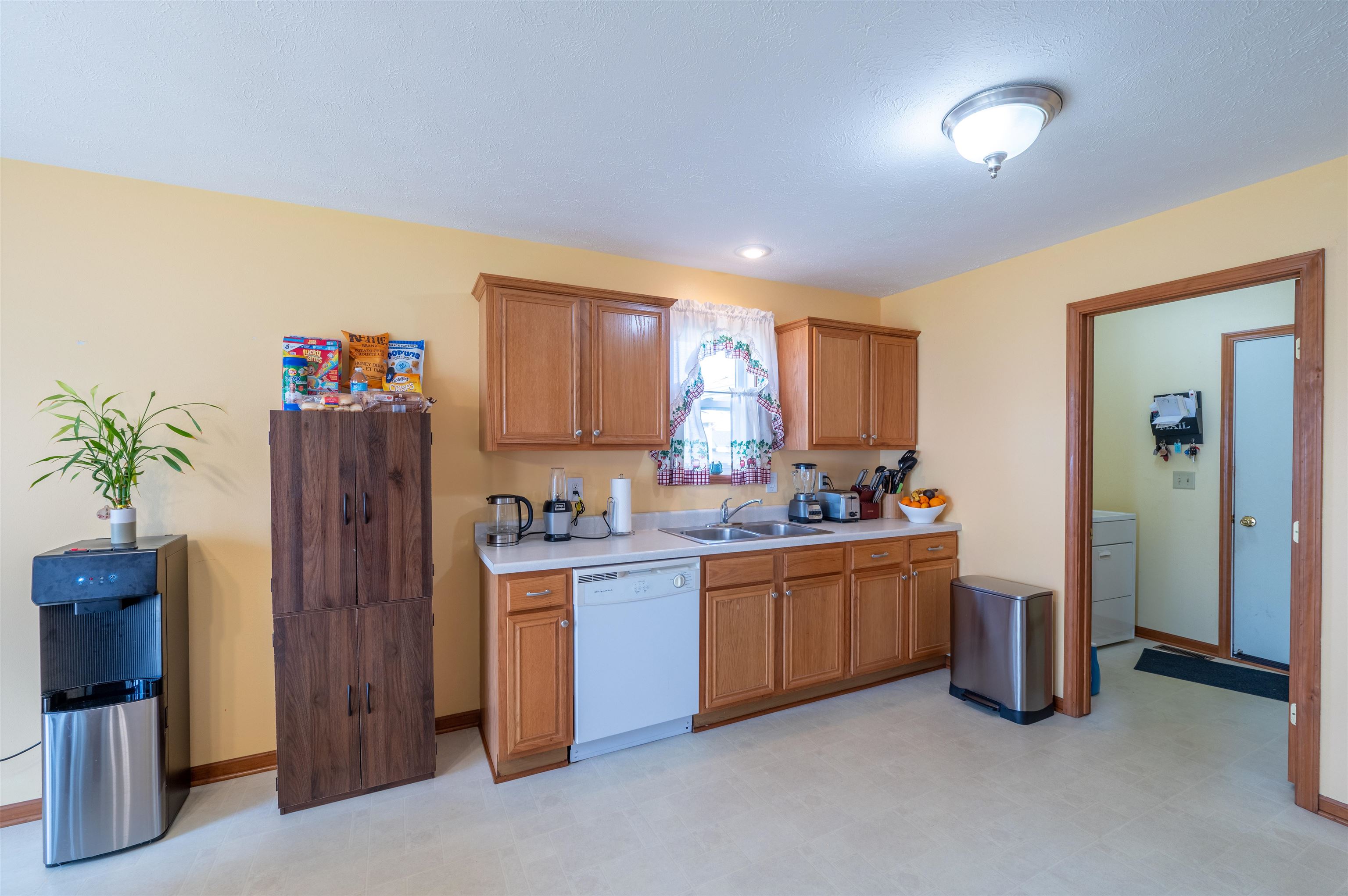 726 Golden Prairie Drive Davis Junction, IL 61020 - Photo 9 of 29 a kitchen with sink a refrigerator and a stove top oven