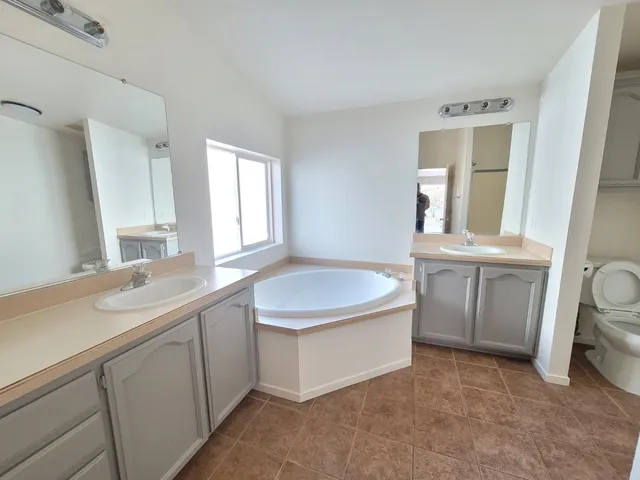 a kitchen with a stove and a refrigerator