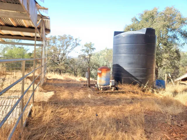 a view of a yard covered in snow