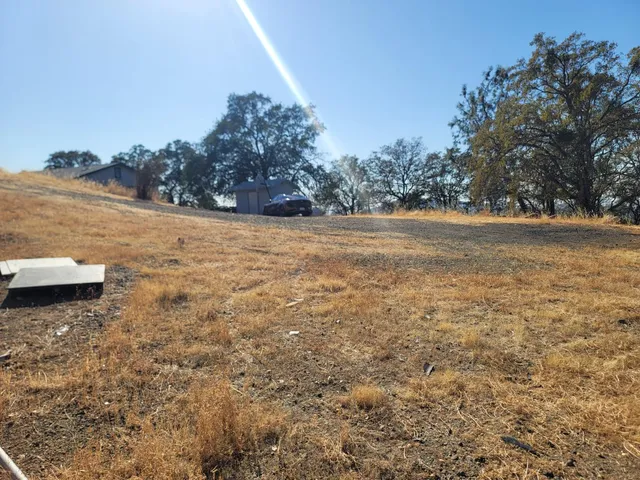 a view of a house with snow on the background