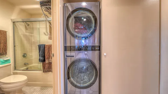 a bathroom with a sink mirror vanity and toilet