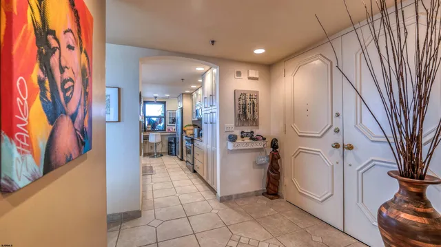 a view of a hallway with dining area