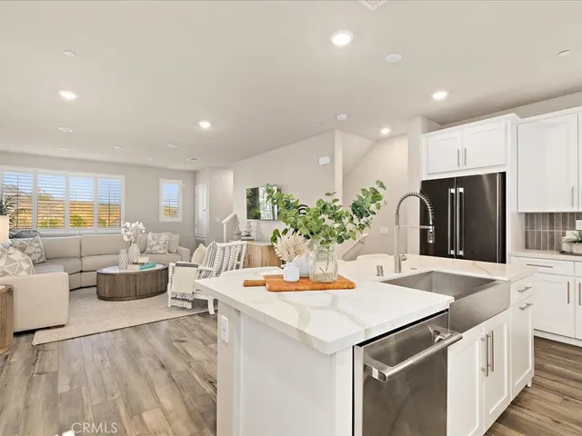 a front view of a building with plants