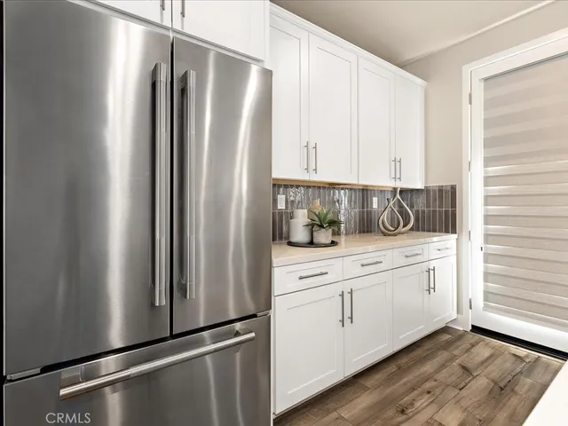 a stove sitting inside of a kitchen with granite countertop