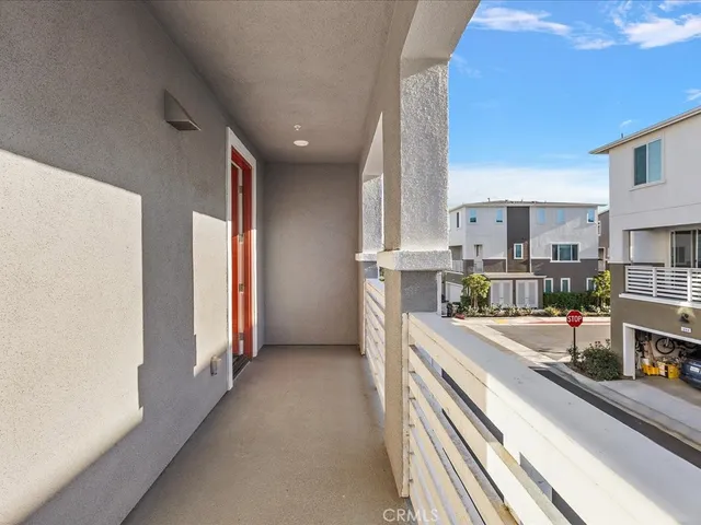a view of brick house with large windows