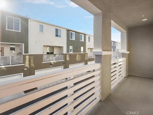 front view of a brick house with a large window