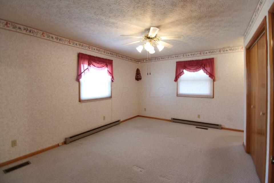 8091 Cincinnati-Zanesville Road Southwest Amanda, OH 43102 - Photo 11 of 24 Primary Bedroom has an ensuite bathroom.