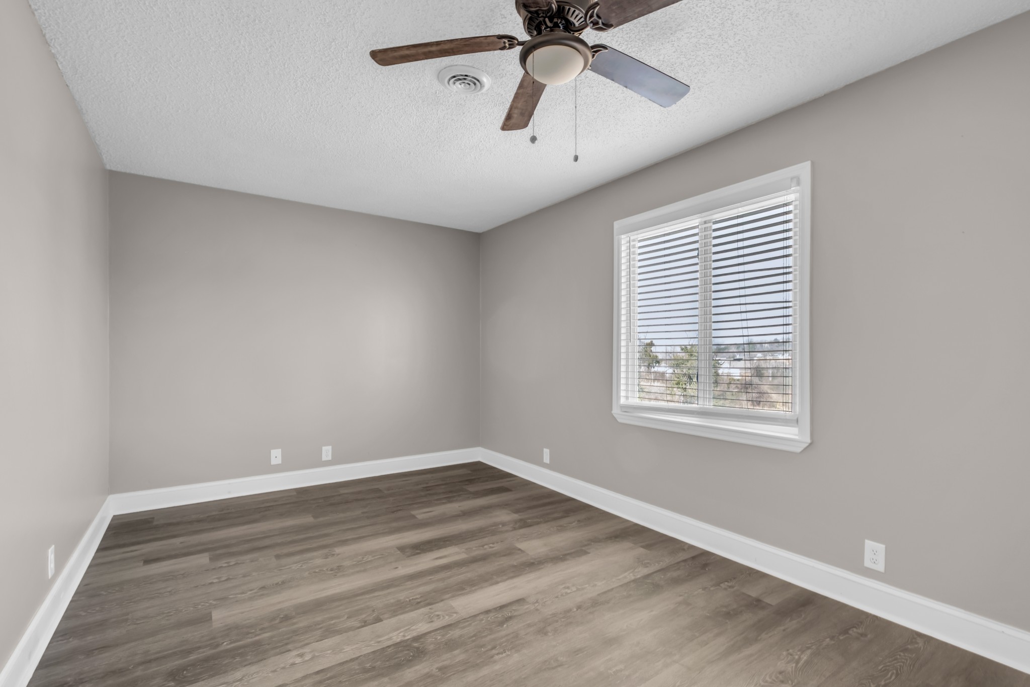 403 Raintree Drive Hermitage, TN 37076 - Photo 12 of 22 wooden floor in an empty room with a window
