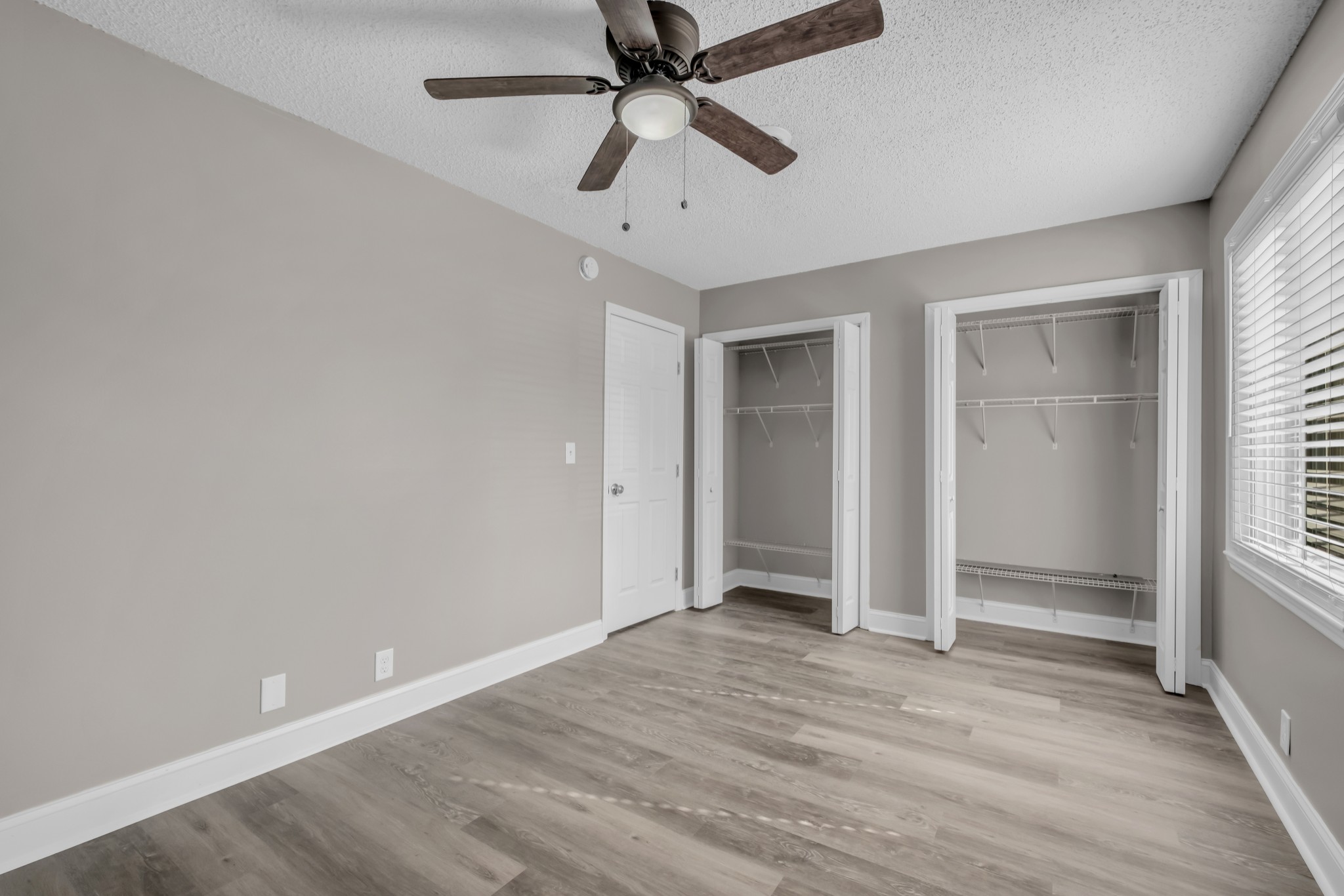 403 Raintree Drive Hermitage, TN 37076 - Photo 18 of 22 an empty room with a ceiling fan and window