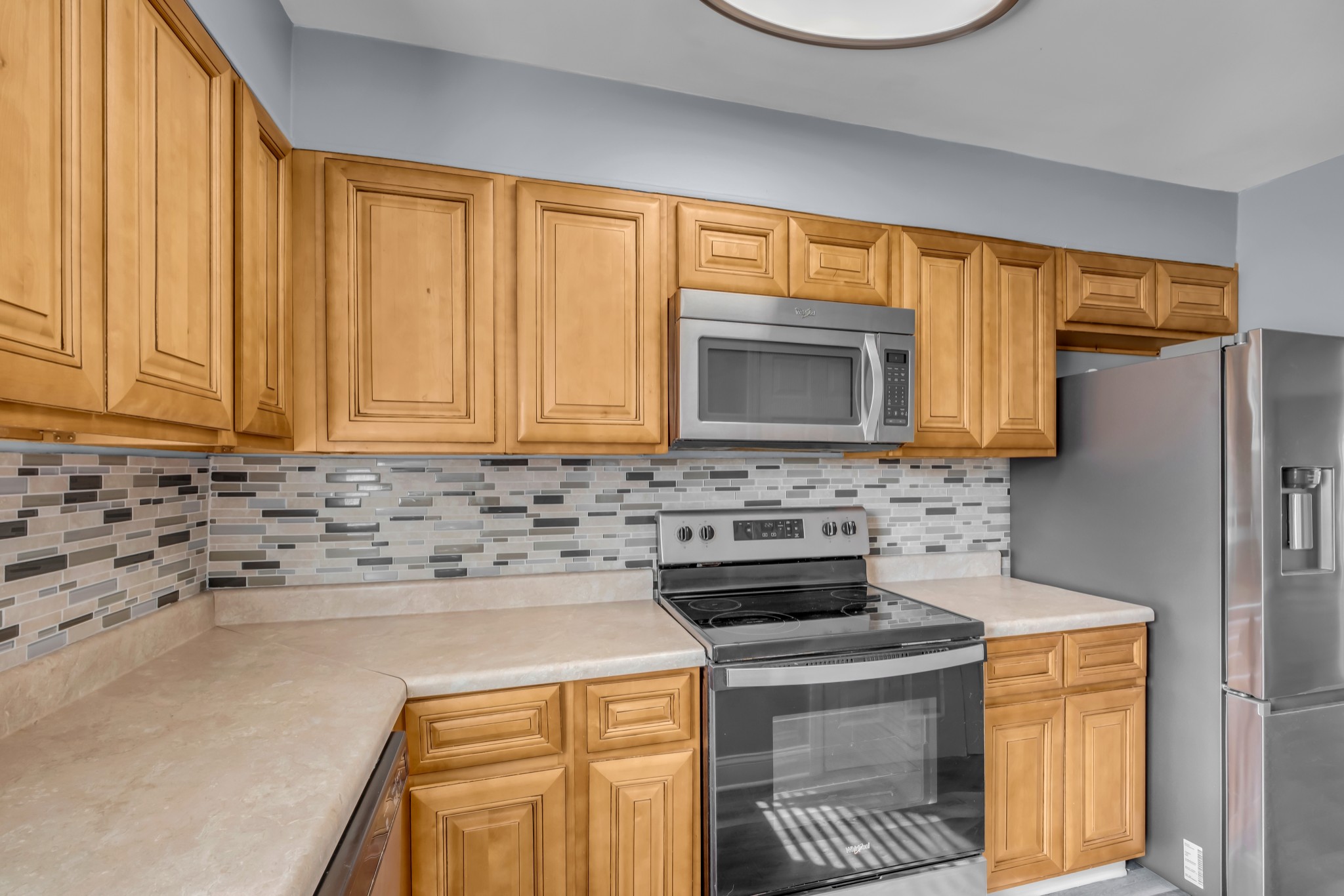 403 Raintree Drive Hermitage, TN 37076 - Photo 8 of 22 a kitchen with stainless steel appliances a stove a sink and a microwave