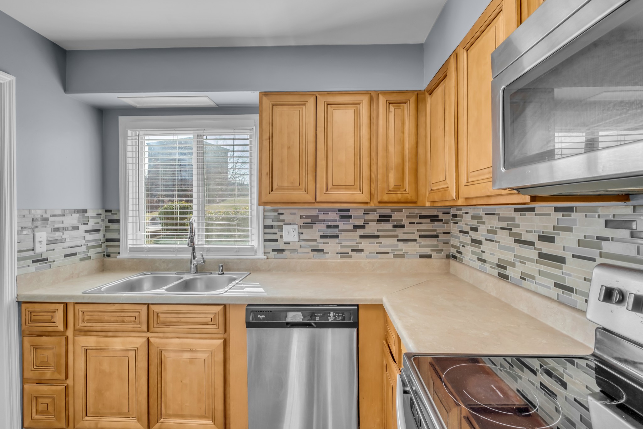 403 Raintree Drive Hermitage, TN 37076 - Photo 9 of 22 a kitchen with granite countertop cabinets sink and window