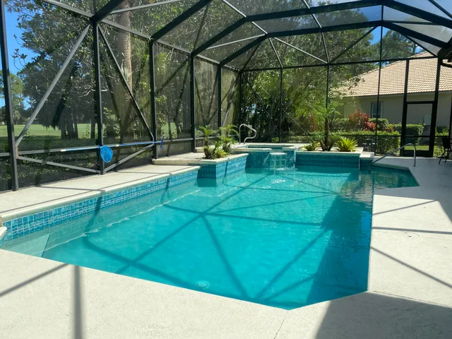 a view of a swimming pool with a patio