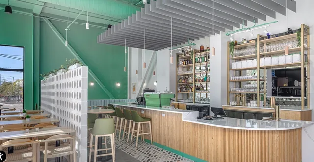 a view of balcony with a table and chairs