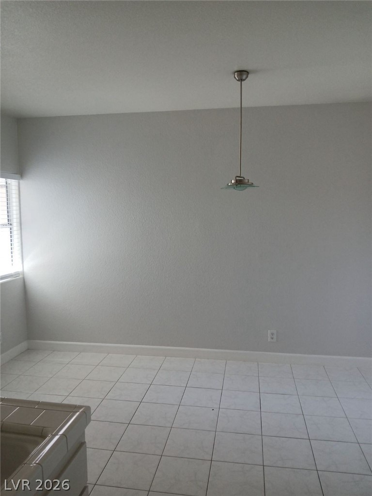 2201 Ramsgate Drive, Unit 426 Henderson, NV 89074 - Photo 22 of 22 This bright space features sleek tile flooring and a modern ceiling pendant.