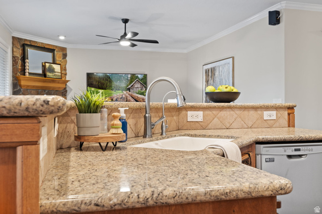 6208 West Bull River Road Highland, UT 84003 - Photo 26 of 90 Kitchen featuring granite countertops, undermount sink with gooseneck faucet, light wood-finish cabinetry, and a neutral-toned tile backsplash