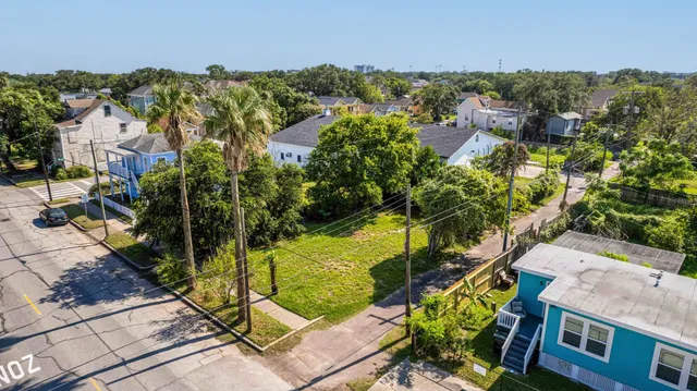an aerial view of multiple houses with yard