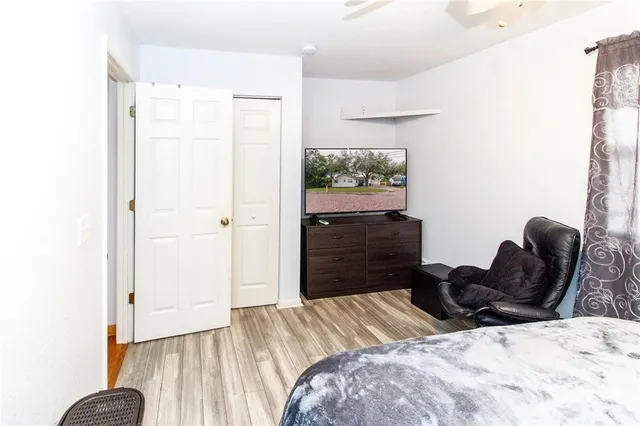 a bedroom with a bed and a dresser