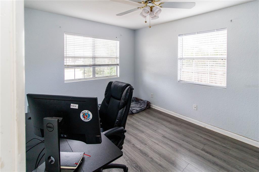 525 4th Avenue Southwest Largo, FL 33770 - Photo 18 of 27 a view of a workspace with furniture and a window