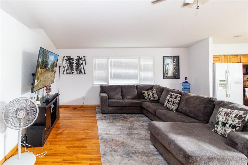 525 4th Avenue Southwest Largo, FL 33770 - Photo 2 of 27 a living room with furniture and a flat screen tv